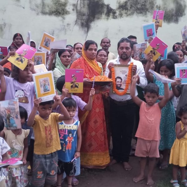 LJP leader Ranjan Paswan distributed notebooks and pens among the children.